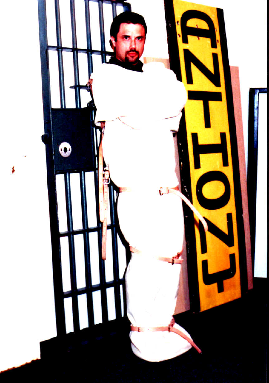 Anthony Martin in a straight jacket